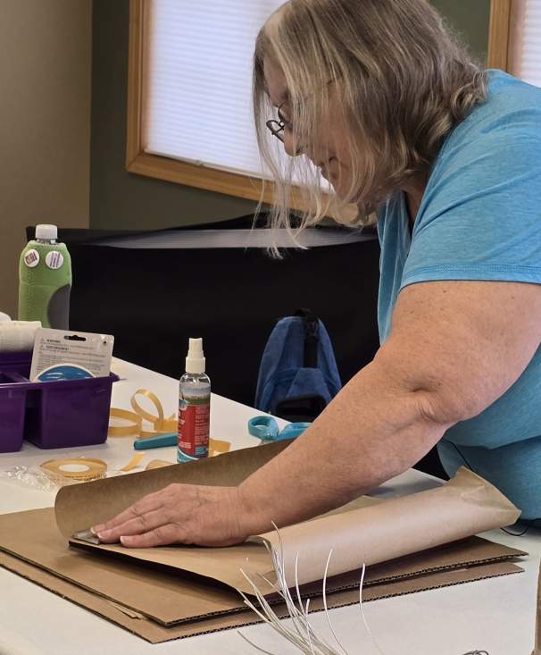 June cutting dust cover paper to size